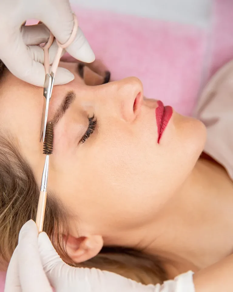 Eyebrow shaping with scissors and a brow brush at Robert's Salon and Spa in Belmont, MA