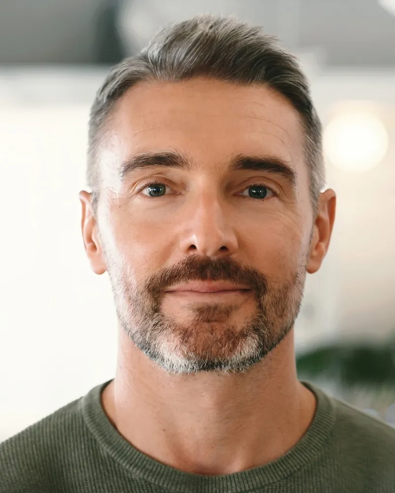 Man with gray blended through his hair at Robert's Salon and Spa in Belmont, MA